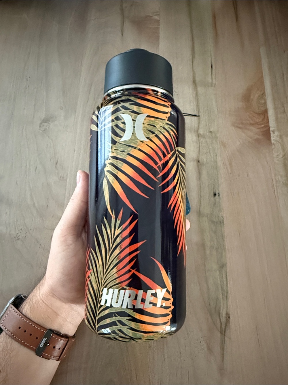 Hurley Black Bottle with Orange & Gold Tropical Leaf Design